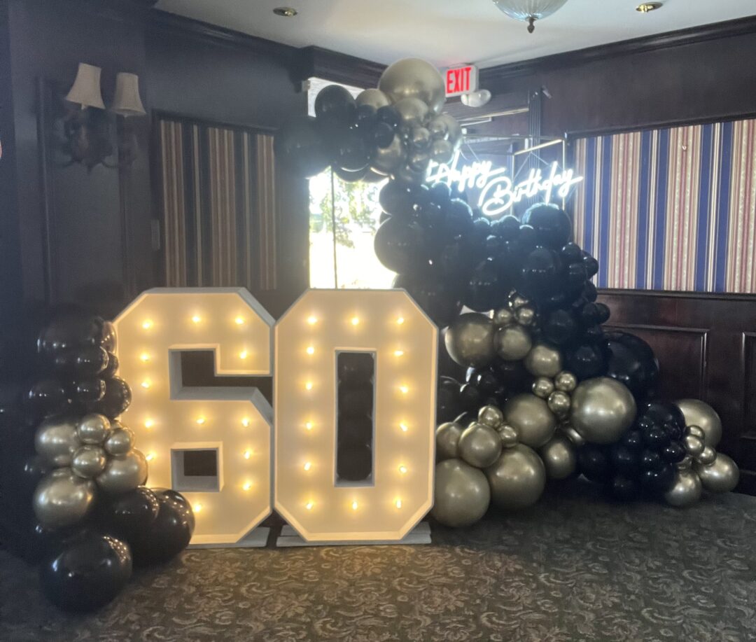 Organic Balloons set up with Marquee numbers*